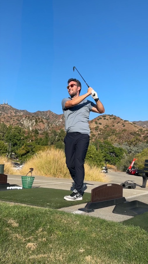 Max mid golf swing, driving range with mountains