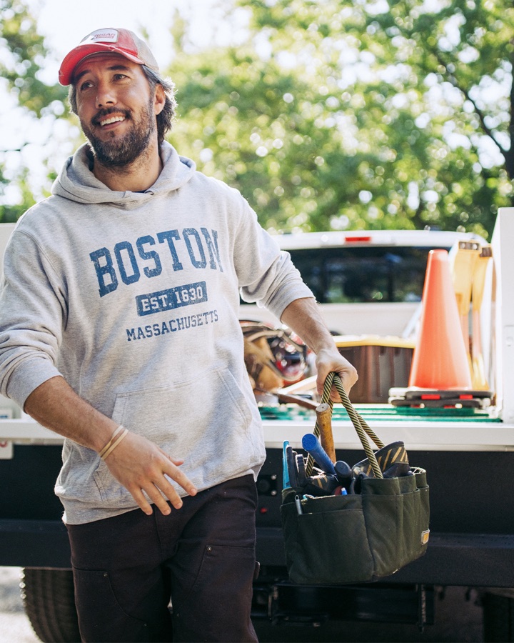 Max as a tradesman with tool bag at the tailgate of a Knapheide service truck
