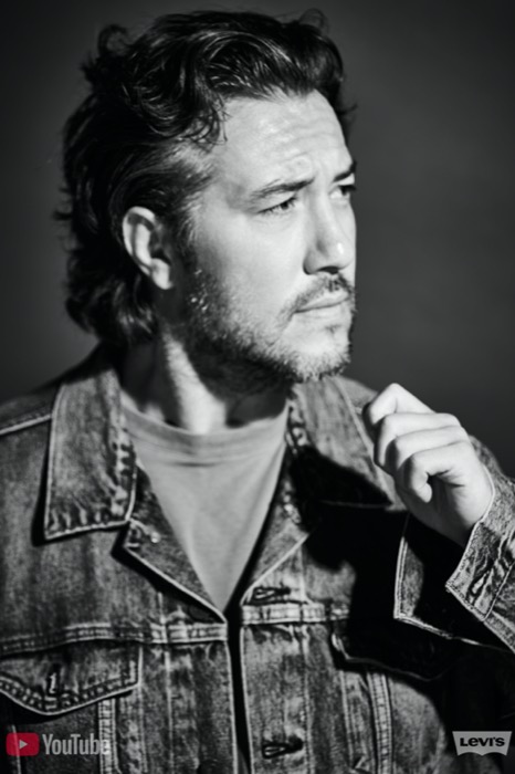 Max in a denim jacket, black and white editorial portrait