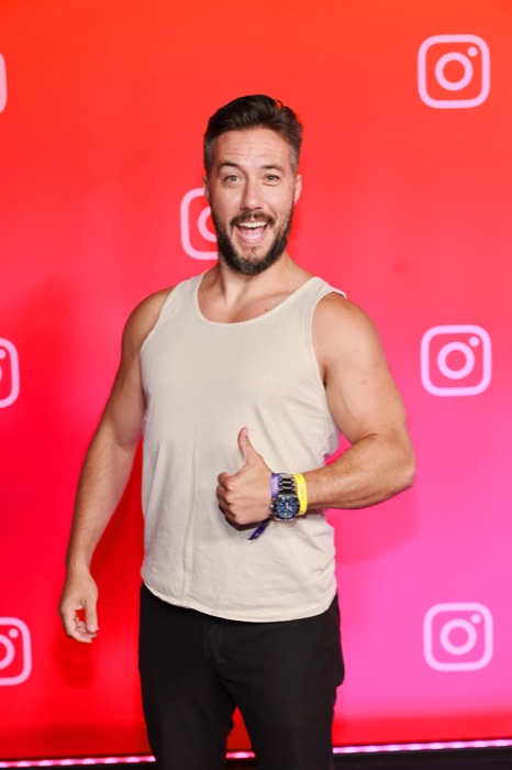 Max at the VidCon Instagram wall, thumbs up