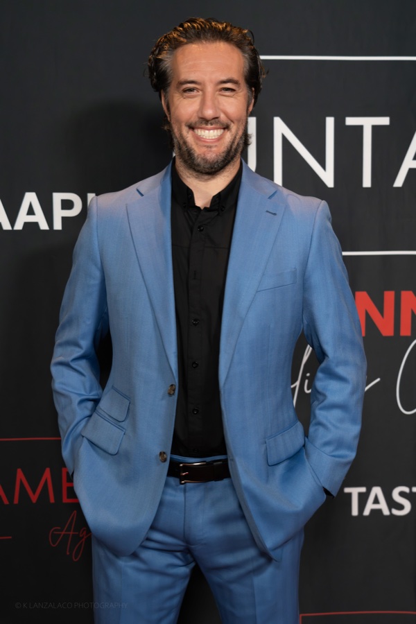 Max in a light blue suit on the red carpet at the Untamed Gala