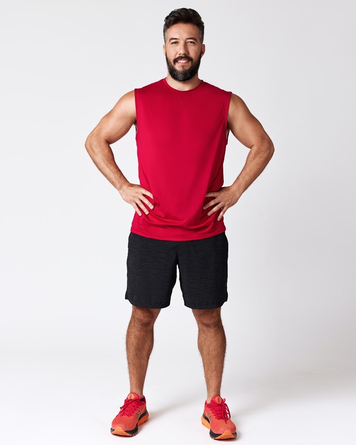 Max in athletic red tank, full body